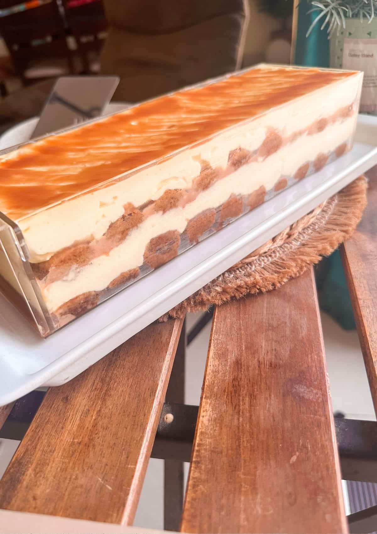 chilled and assembled tiramisu shown in a see through container.