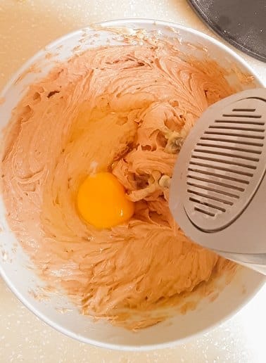raw egg in a cake batter ready to be mixed