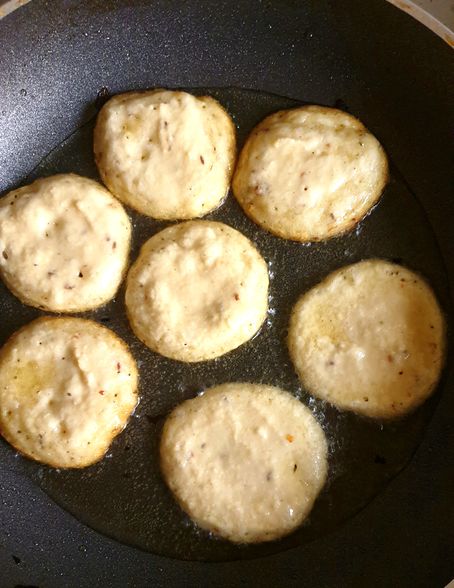 lentil fritters shallow frying in a pan