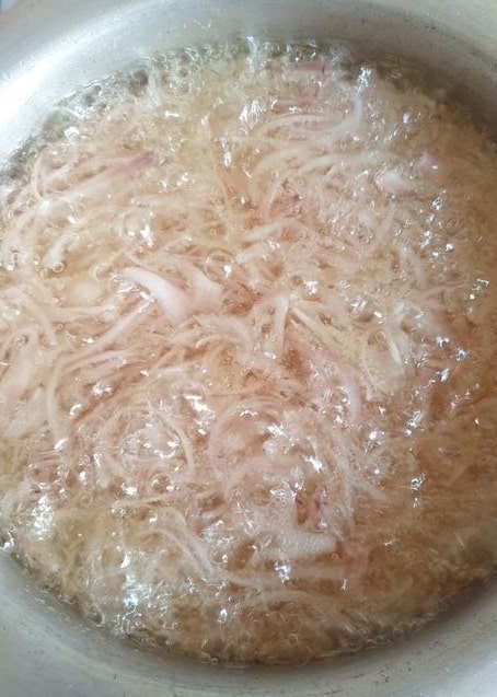 onions being fried in oil