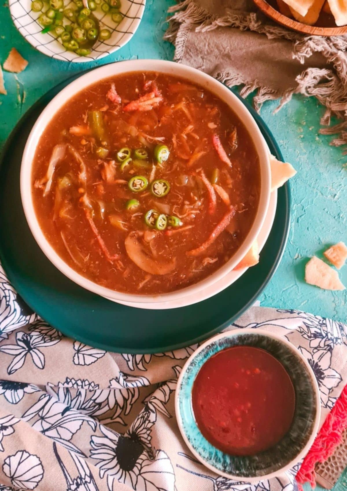 Chicken hot and sour soup served in a bowl.