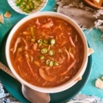 Chicken hot and sour soup served in a bowl.