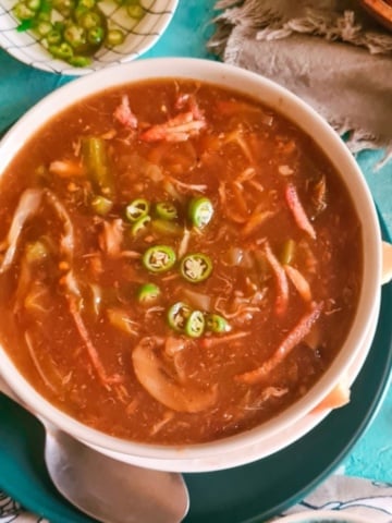 Chicken hot and sour soup served in a bowl.