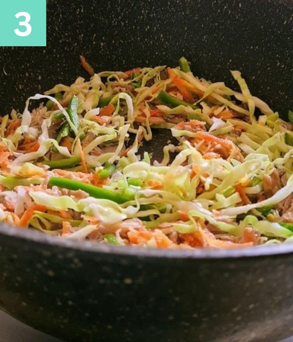 pan with raw vegetables in it.