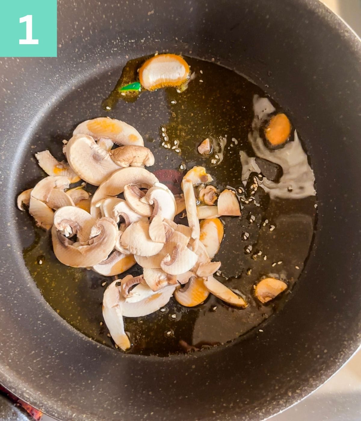 mushrooms in chili oil in a pan.