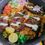fish tahiri or tehri in a pot with salad and lemon