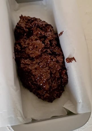 pouring chocolate mix in the loaf pan