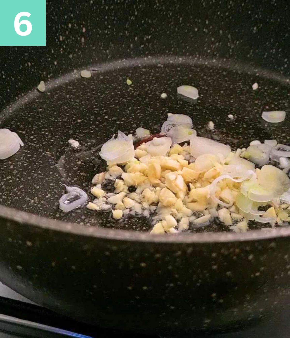 minced garlic and onions in oil in a pot.