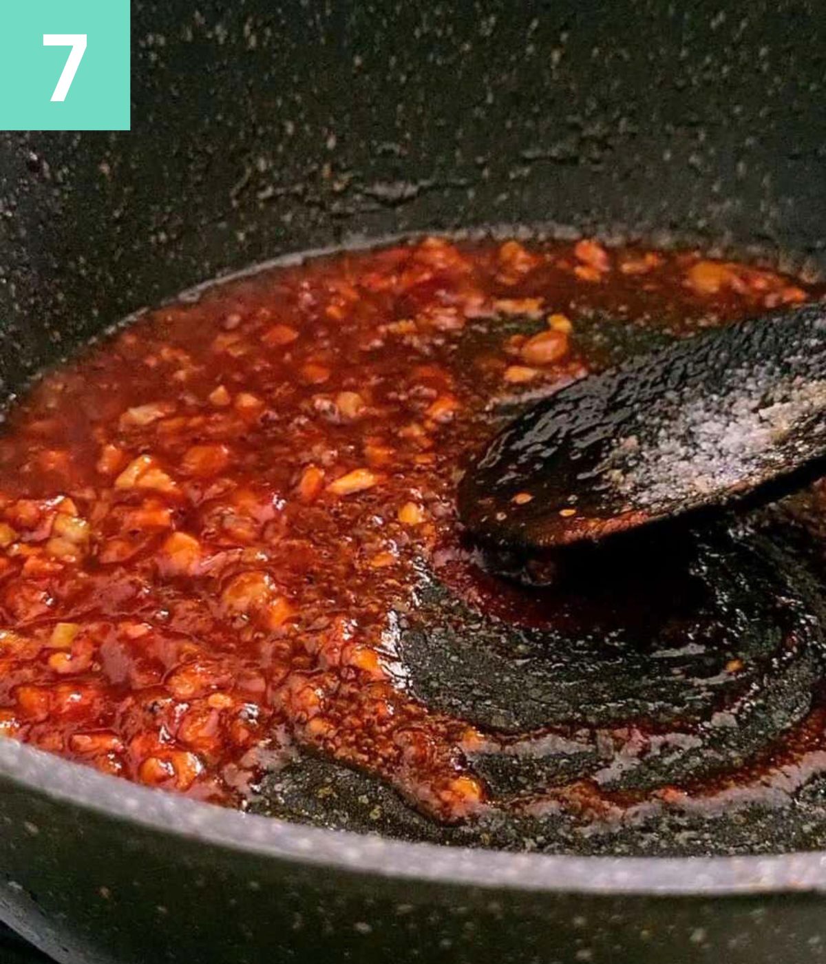 tomato paste and seasoning added to the pot and mixed.