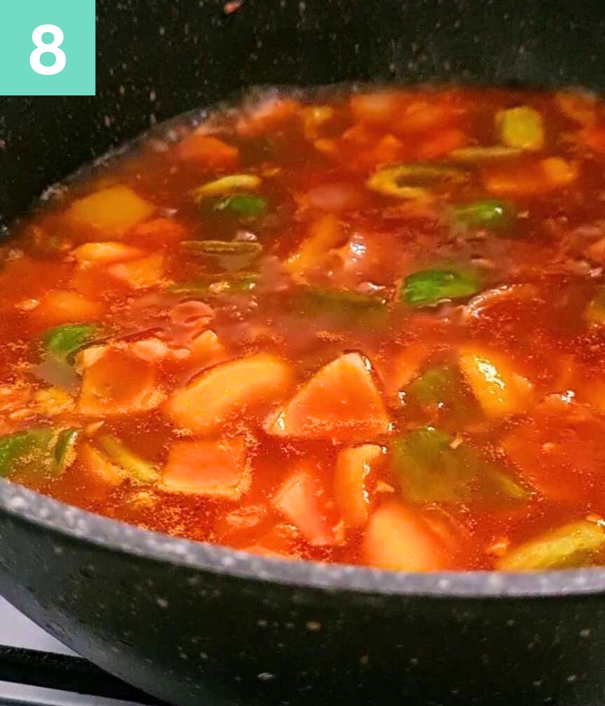 sauces, diced vegetables and water added to the pot.