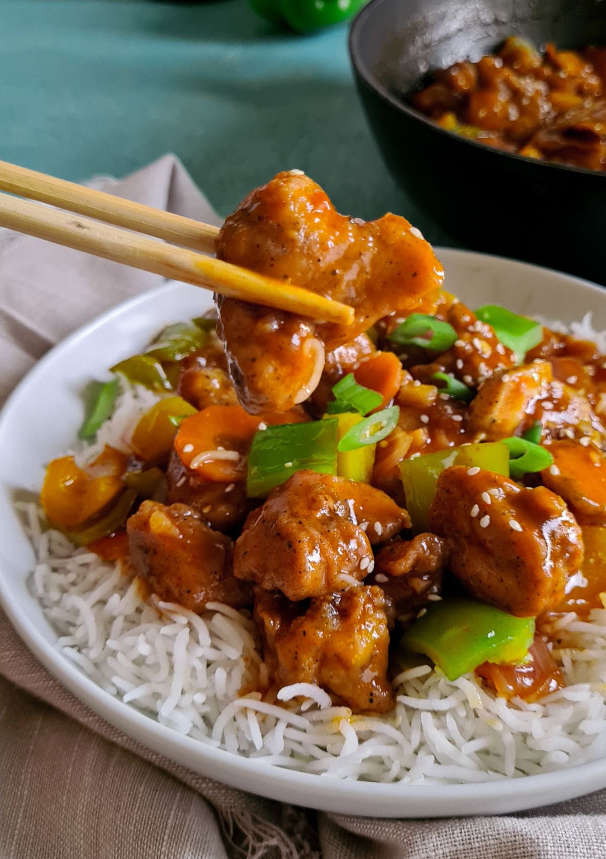 sweet and sour chicken served with rice.