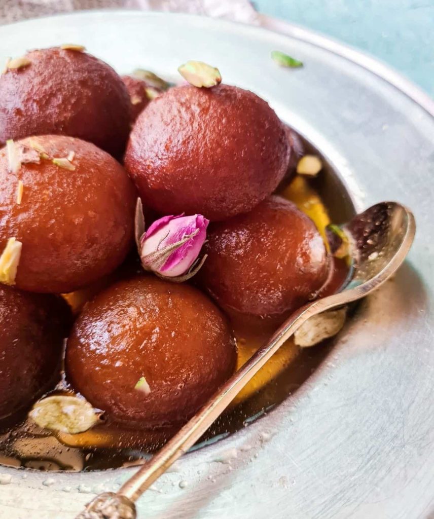 side view of a plate holding gulab jamuns