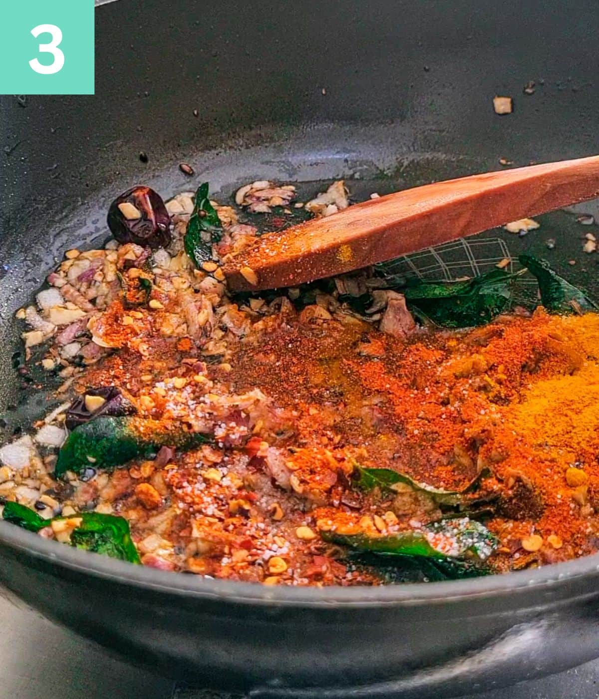 adding spices to chutney base.