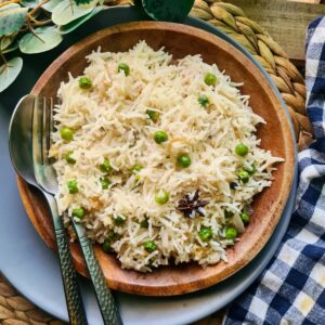 pea pulao served in a brown plate