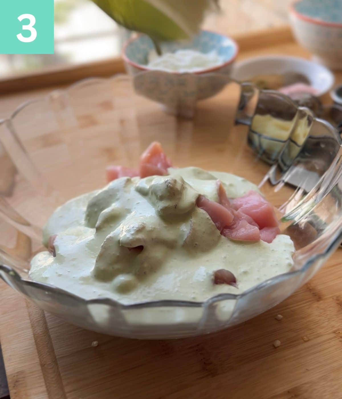 step 3: chili yogurt paste with raw chicken in a bowl.