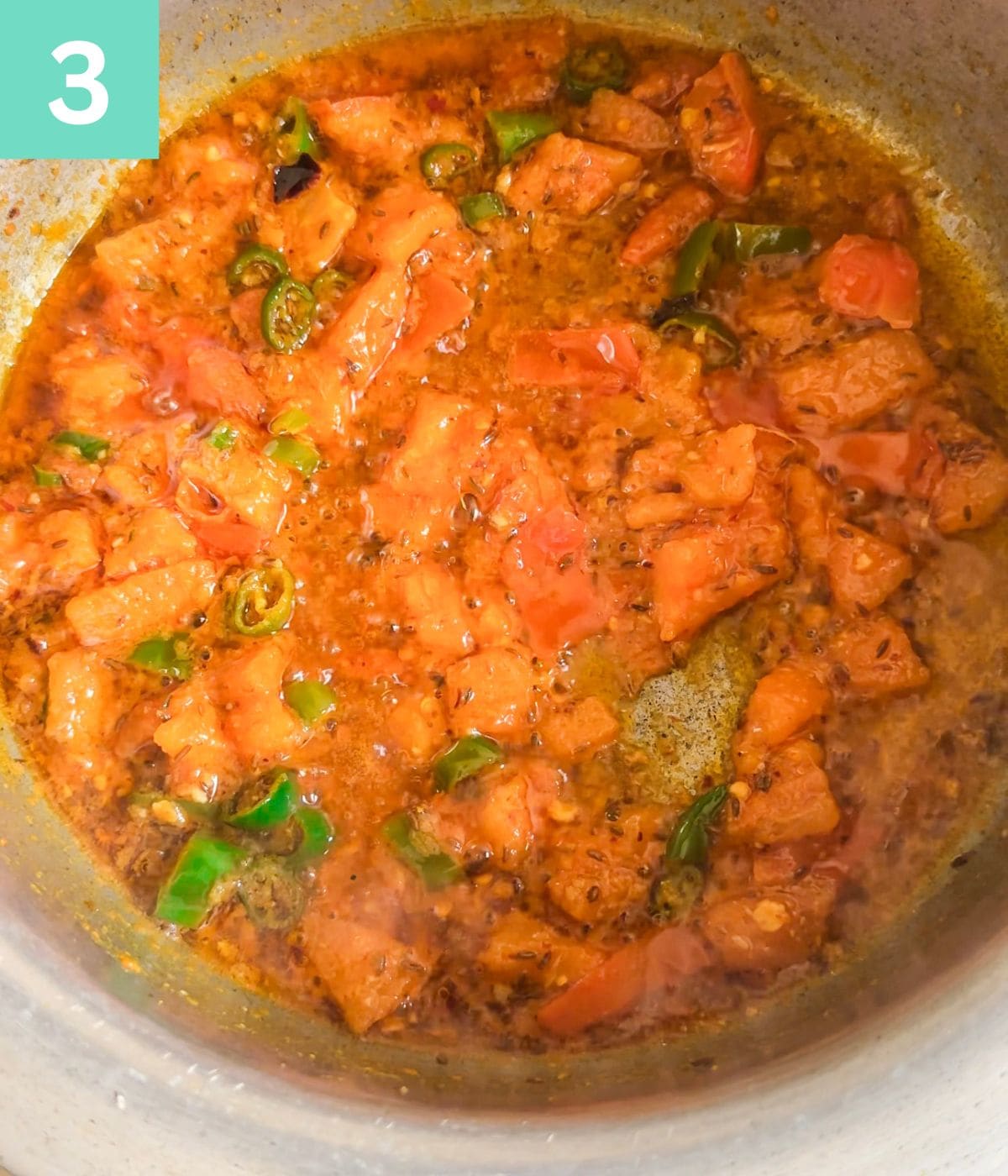 khichdi base ready with tomatoes and spices tempered and semi cooked.