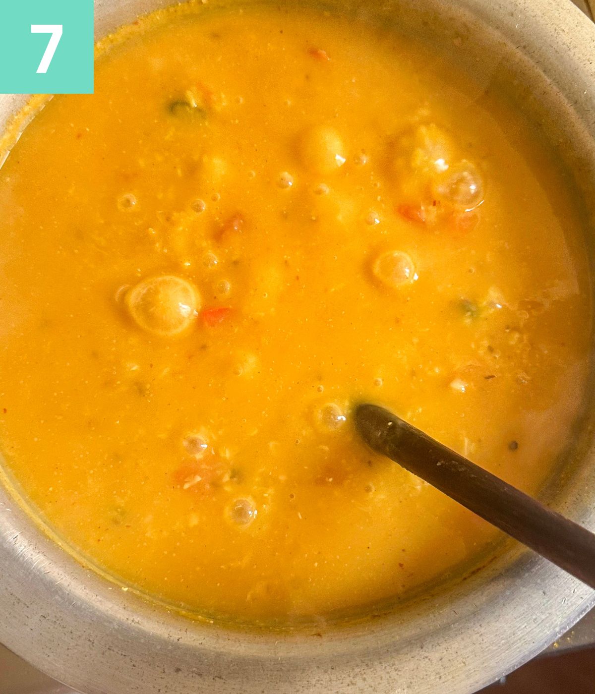 khichdi bubbling in pot.