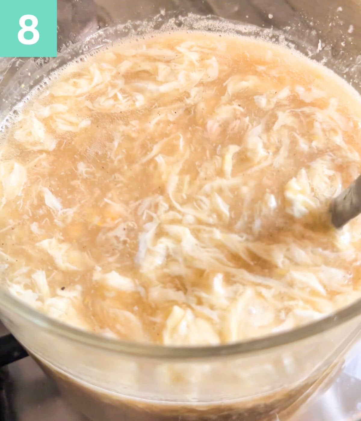 chicken corn soup with egg ready in the stockpot.