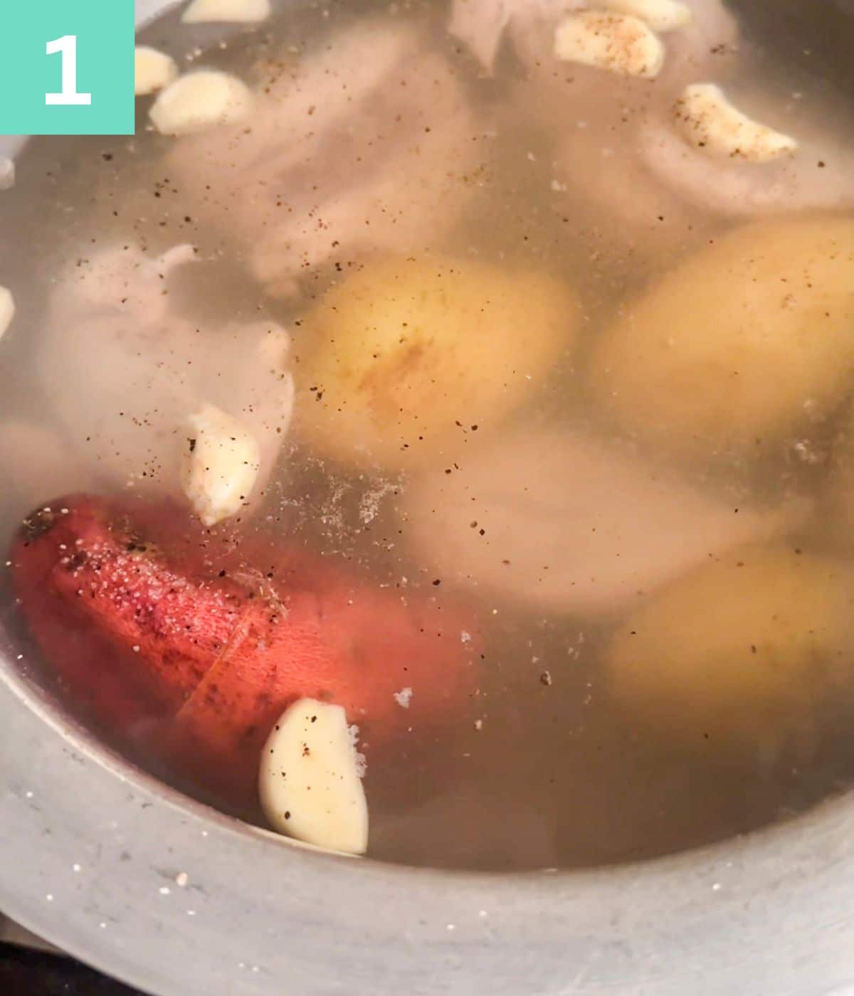 raw potatoes and chicken in water.