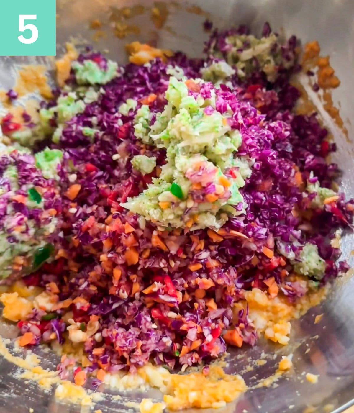 finely chopped vegtables added to mashed potatoes bowl.