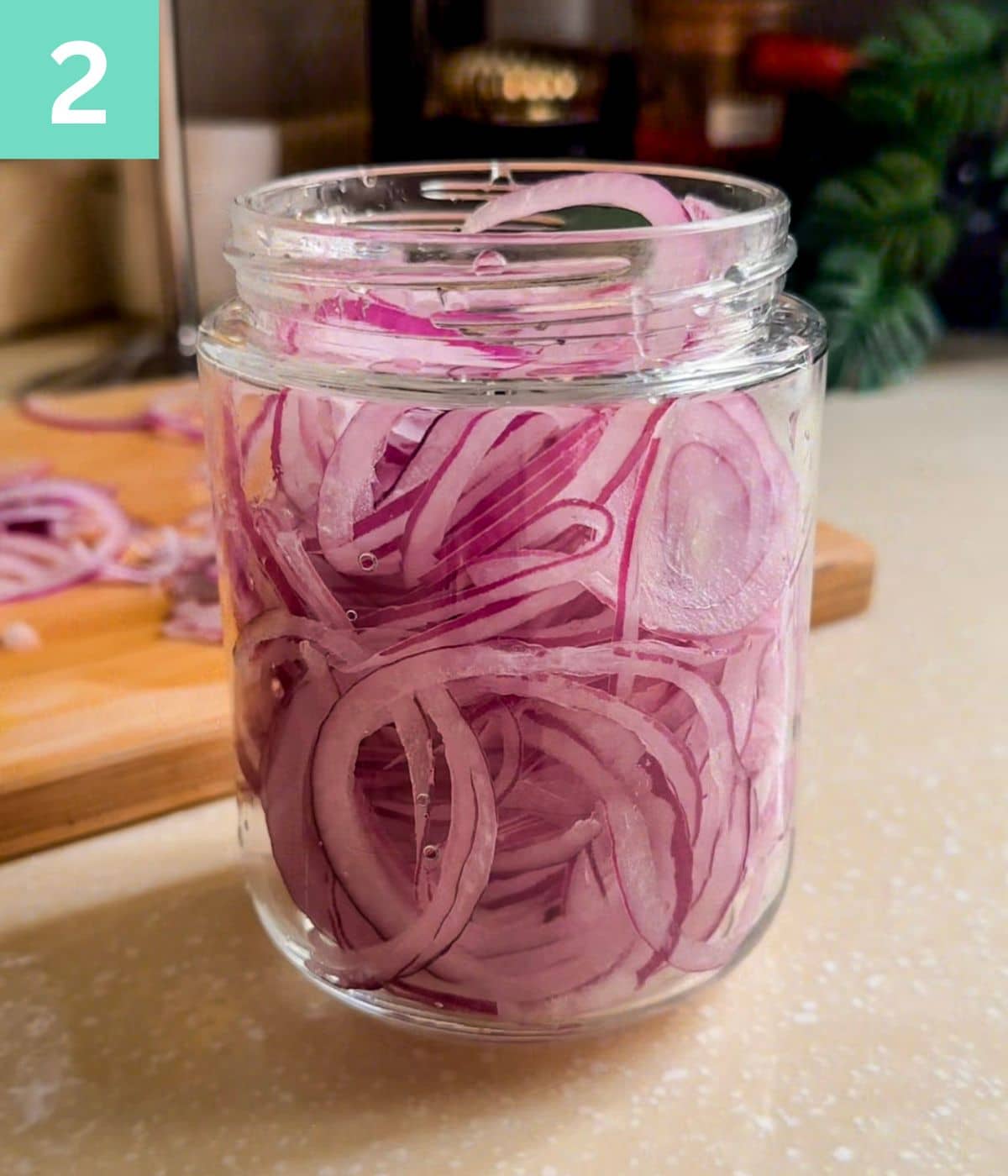 sliced onions in a jar.