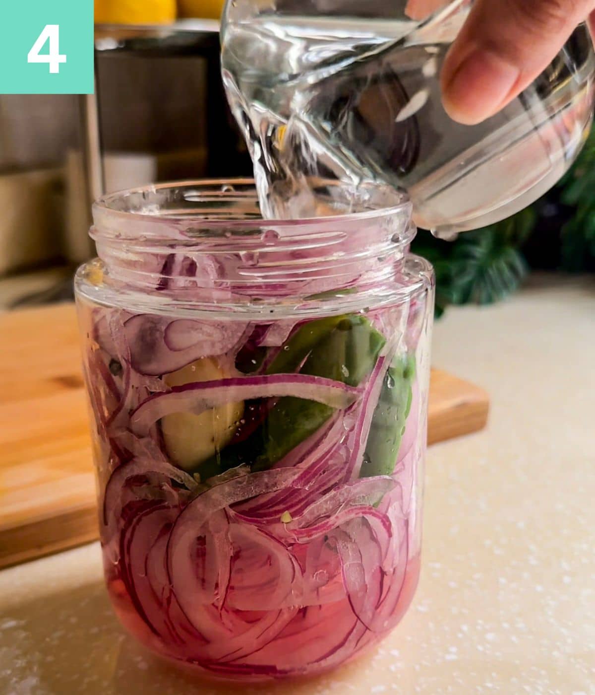 water pouring in onion jar.